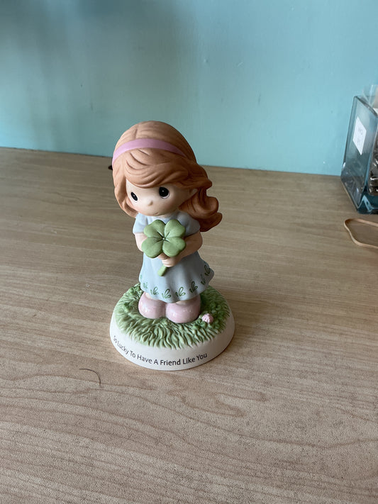 Girl Holding Four Leag Clover